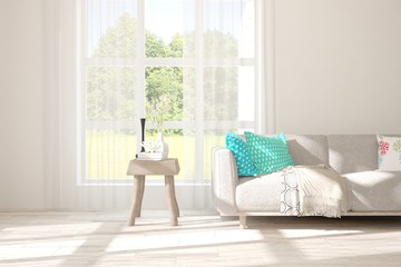 Stylish room in white color with sofa and summer landscape in window. Scandinavian interior design. 3D illustration