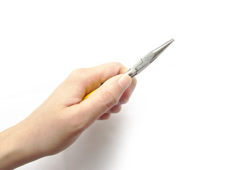 Small thin-nose pliers with yellow handles are squeezed in the left hand an isolated object on a white background.