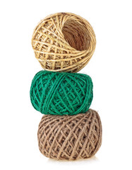 Colored rolls of rope on a white background. Household rope.