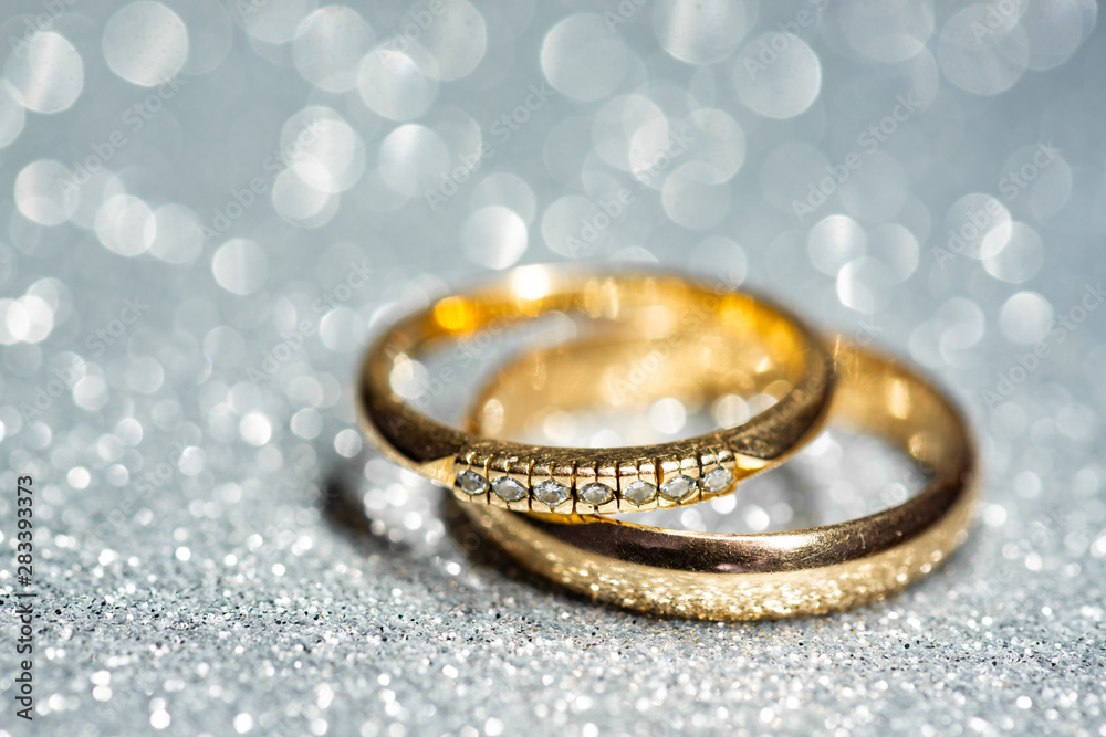 Sticker gold wedding rings. glitter background