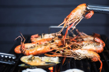 BBQ Grilled shrimps on flaming grill