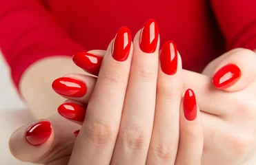 hands with red manicure.