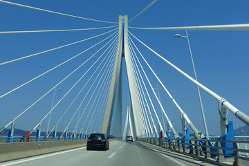 Driving through famous modern anti seismic cable bridge of Rio Antirio Harilaos Trikoupis that connects Peloponnese to mainland Greece