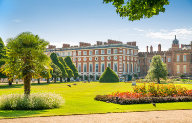 Fototapeta premium London, UK. English garden view and the East Front of Hampton court 17th century locates West London