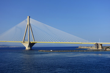 Fototapeta na wymiar Famous modern anti seismic cable bridge of Rio Antirio Harilaos Trikoupis that connects Peloponnese to mainland Greece