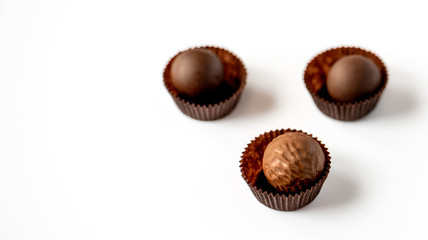 Chocolate pralines isolated on white background