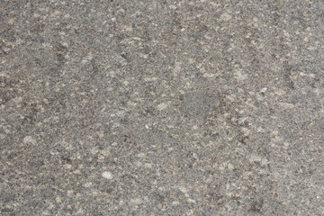 Natural stone backgrounds on the wall and sidewalk.