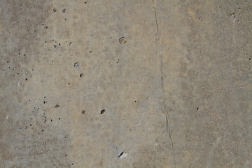 Natural stone backgrounds on the wall and sidewalk.