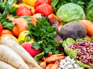 Many different vegetables lie on the table.