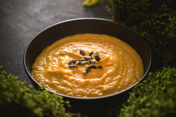 Pumpkin cream soup with cream and pumpkin seeds