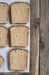 Rye bread slices on a wooden table