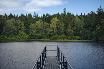 Lake landscape through the railing on a platform