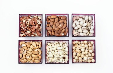 Different types of nuts: peanuts, cashews, almonds, hazelnuts, walnuts and pistachios, horizontal orientation