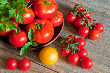 Fresh organic tomatoes on a wooden table