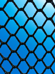 Fototapeta premium Background, black silk mesh. Against the background of the deep sky. basketball. volleyball tennis