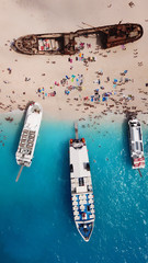 Aerial drone view of iconic beach of Navagio or Shipwreck voted one of the most beautiful beaches in the world with deep turquoise clear sea, Zakynthos island, Ionian, Greece
