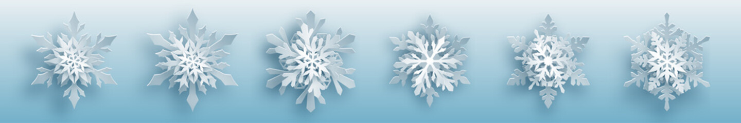 Christmas set of white complex paper snowflakes with soft shadows on light blue background