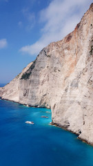 Aerial drone view of iconic beach of Navagio or Shipwreck voted one of the most beautiful beaches in the world with deep turquoise clear sea, Zakynthos island, Ionian, Greece