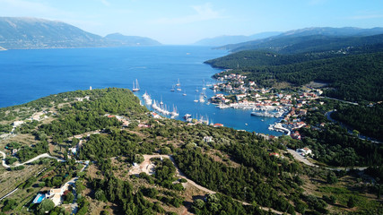 Fototapeta na wymiar Aerial drone photo of picturesque and iconic port of Fiskardo with luxury boats docked and traditional character at sunset, Cefalonia island, Ionian, Greece