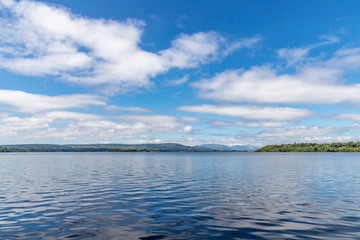 Lough Corrib with forest and Conerama mountains in background