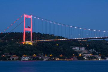 Fototapeta premium Long exposure shot of Fatih Sultan Mehmet Bridge ( FSM ) with light trails after sunset over bosphorus in Istanbul,Turkey. Built in 1988 and connecting Europe and Asia