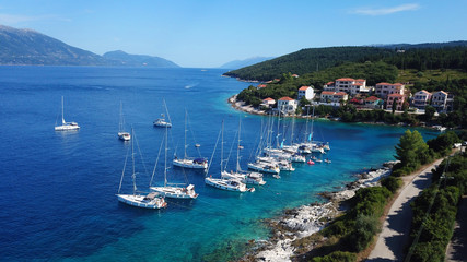 Fototapeta premium Aerial drone photo of picturesque and iconic port of Fiskardo with luxury boats docked and traditional character, Cefalonia island, Ionian, Greece