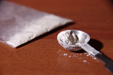 cocaine on the table (white powder)
