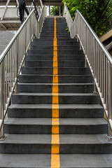 Yellow line and stairs.