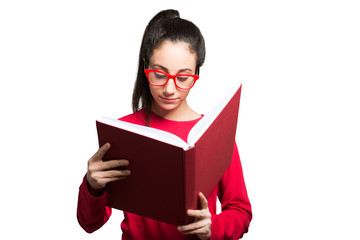 Teenager reading a book. Isolated on white