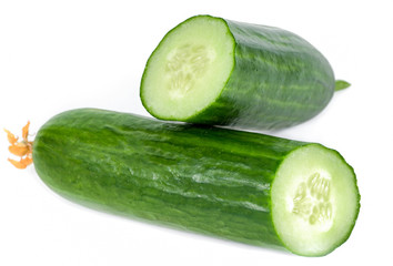 Cucumber and slices isolated over white background.