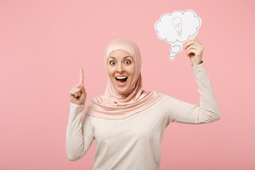 Arabian muslim woman in hijab light clothes posing isolated on pink background. People religious...