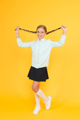 Educational activity. Homeschooling or visiting regular school. Efficiency of studying. Adorable schoolgirl. Happy schoolgirl. Schoolgirl happy smiling pupil long hair. Beginning of academic year