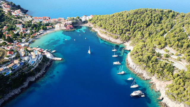 Aerial drone bird's eye view photo of beautiful and picturesque colorful traditional fishing village of Assos in island of Cefalonia, Ionian, Greece © aerial-drone