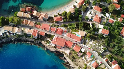 Fotobehang Aerial drone bird's eye view photo of beautiful and picturesque colorful traditional fishing village of Assos in island of Cefalonia, Ionian, Greece © aerial-drone