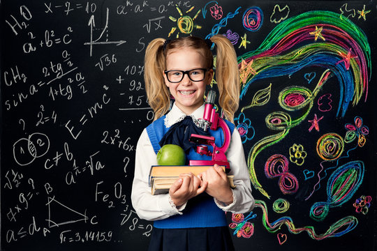 Child Learning Creativity and Mathematics, Creative School Kid Girl Student with Books over Art Blackboard, Education Concept