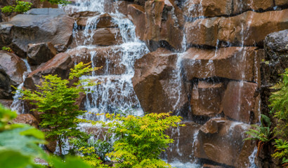 Indoor Garden Waterfall over Brown Stones