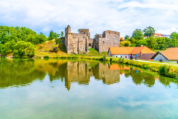 Fototapeta na wymiar Borotin Castle ruins with romantic pond in the foreground, Borotin, South Bohemia, Czech Republic