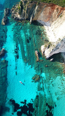 Aerial drone photo of tropical caribbean turquoise bay with large volcanic white cliffs and beautiful emerald sea