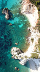 Aerial drone photo of iconic white rock cliffs and volcanic formations near famous beach of Platys and Makrys gialos with turquoise clear sea, Argostoli, Cefalonia island, Ionian, Greece