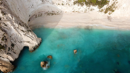 Aerial drone photo of tropical caribbean turquoise bay with large volcanic white cliffs and...