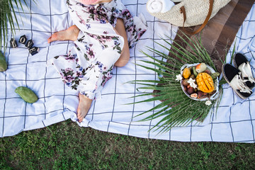 Summer picnic, girl with a plate of fruit
