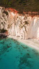Aerial drone photo of tropical caribbean turquoise bay with large volcanic white cliffs and beautiful emerald sea