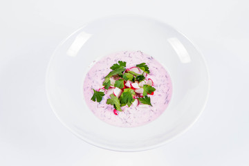 Cold borscht (chlodnik) - traditional Lithuanian cold soup with radish, parsley and dill