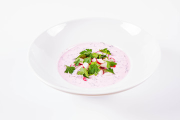 Cold borscht (chlodnik) - traditional Lithuanian cold soup with radish, parsley and dill