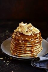 Homemade delicious banana pancakes with caramel sauce.