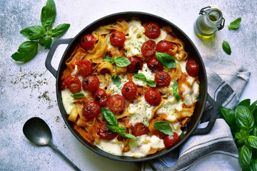 Pasta casserole with tomato and mozzarella.