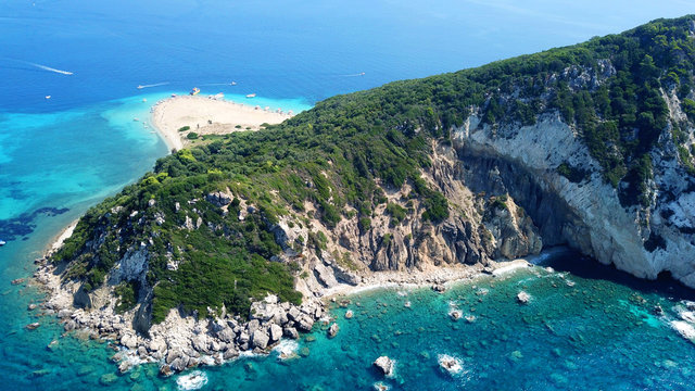 Aerial drone photo of famous white caves and sandy beach in small island of Marathonisi and beautiful turquoise seascape, Zakynthos island, Ionian, Greece