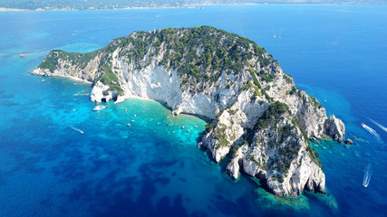 Aerial drone photo of famous white caves in small island of Marathonisi and beautiful turquoise seascape, Zakynthos island, Ionian, Greece
