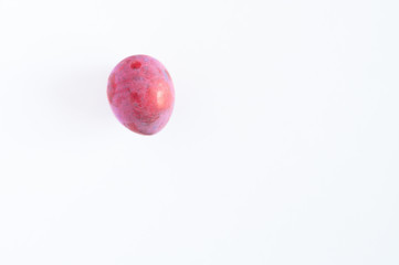 Several fresh ripe plums on white background