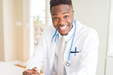 Young african american doctor smiling to the camera wearing stethoscope at the clinic